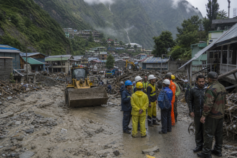 Editorial illustration for Flash floods and mudslide devastate Nepal-China border crossing as rescuers search for missing