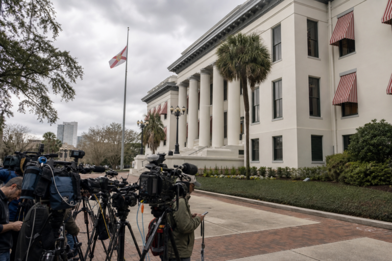 Editorial illustration for Florida grand jury says $10 million was misused in Hope Florida deal; no charges filed