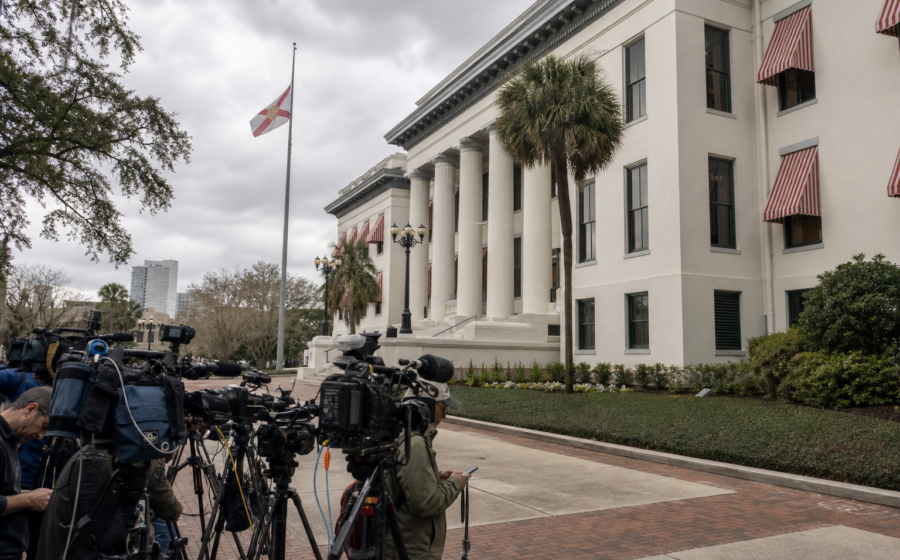 Editorial illustration for Florida grand jury says $10 million was misused in Hope Florida deal; no charges filed
