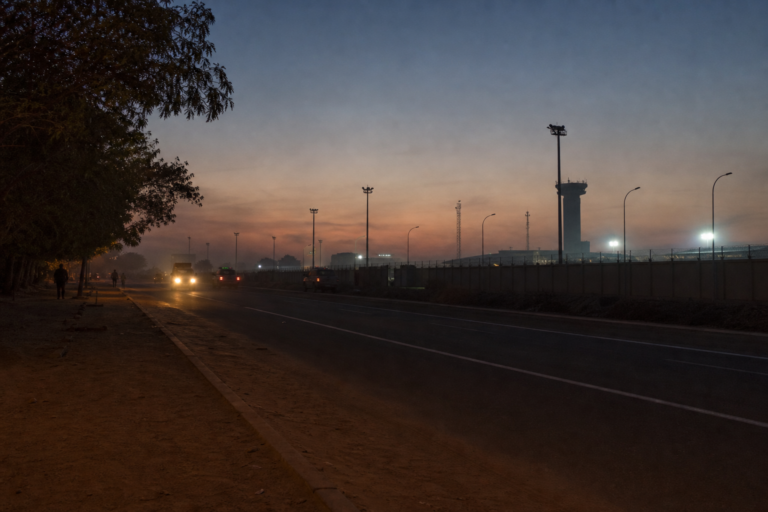 Editorial illustration for Gunfire and Explosions Reported Near Airport and Presidential Area in Niger’s Capital