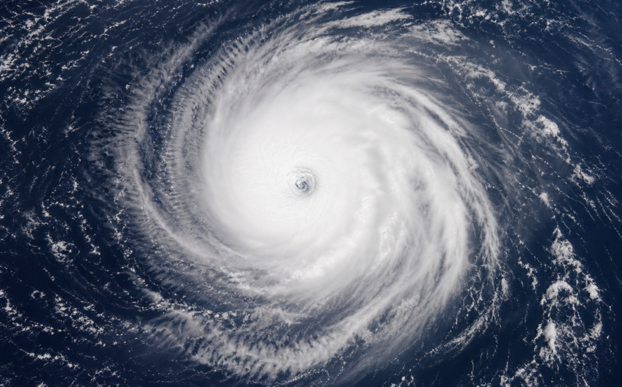 Editorial illustration for Hurricane Karina Is Far From Land, but Its Ocean Swells Still Pose a Coastal Risk